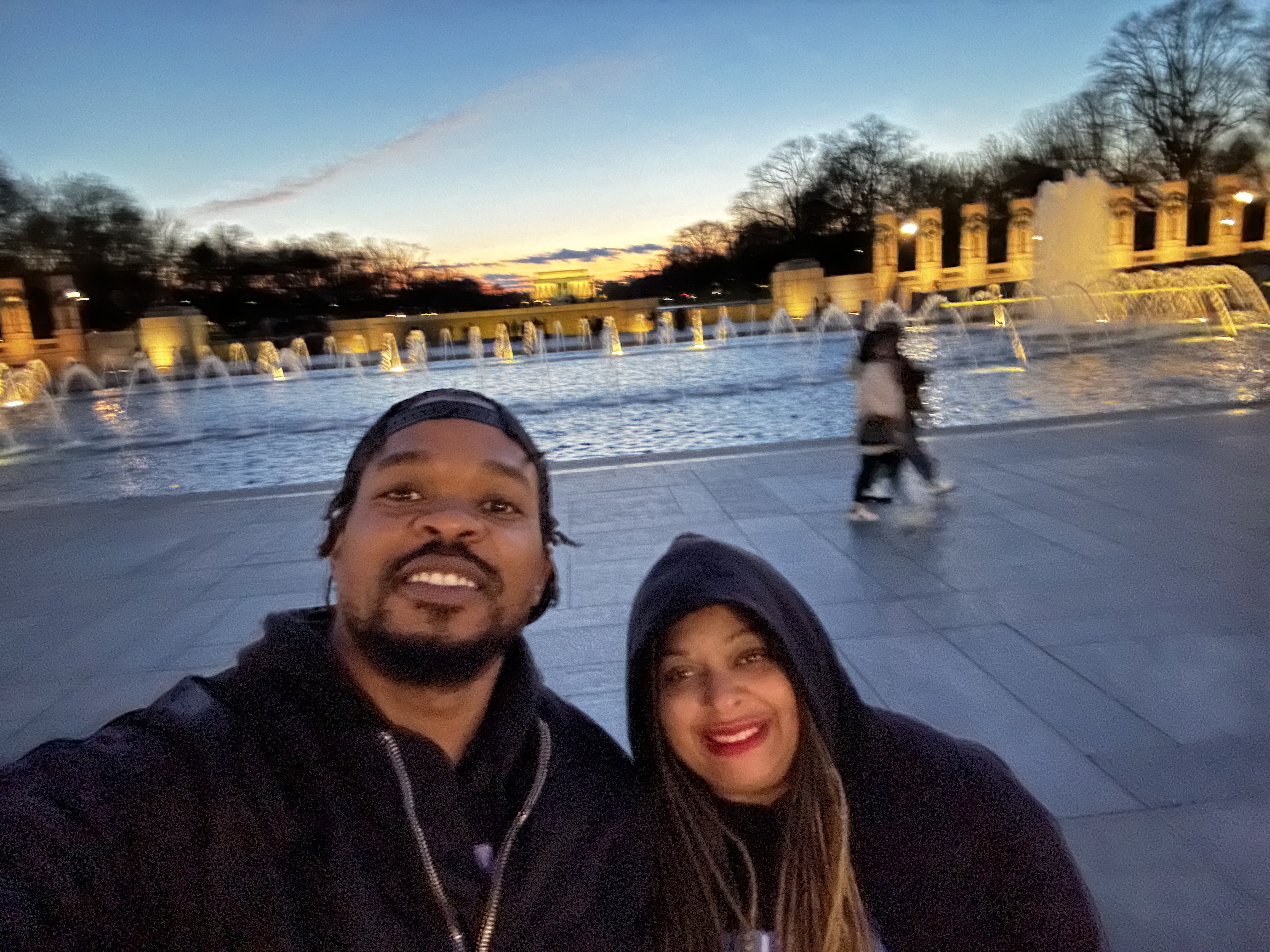 Niambi and friend at the WWII Memorial fountains at sunset