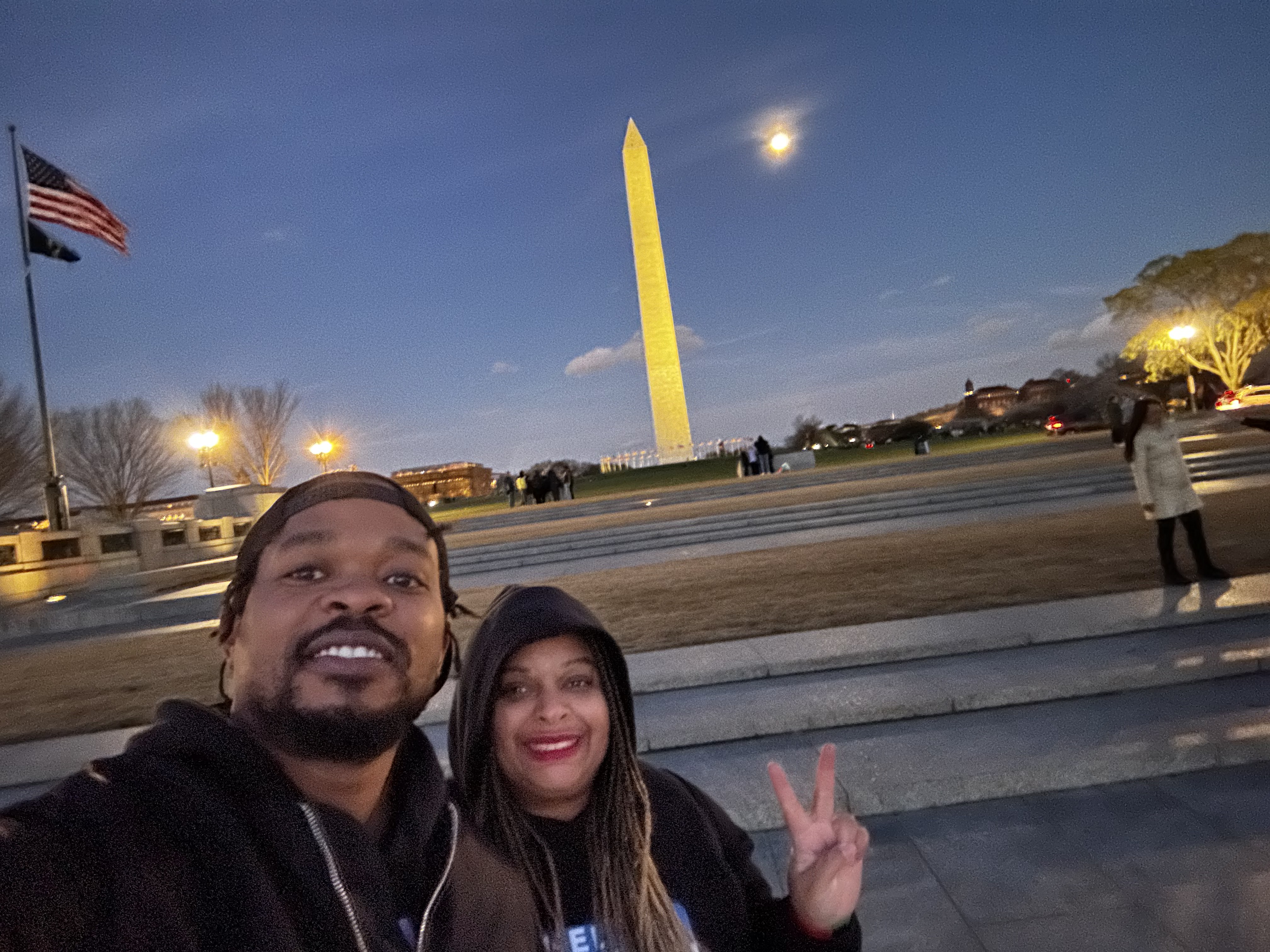 Niambi and friend by the Washington Monument at dusk